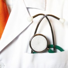 doctor with lab coat and stethoscope